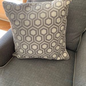 Decorative Pillow with Gray and cream hexagon design.